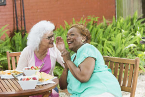 Two senior women having lunch, gossiping